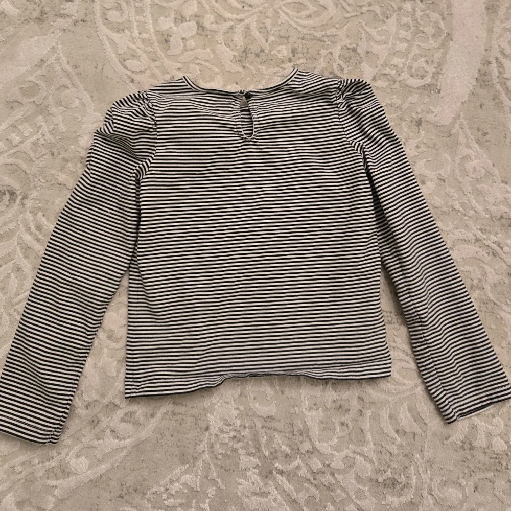 Janie and Jack black and white striped long sleeved top with tulle accent